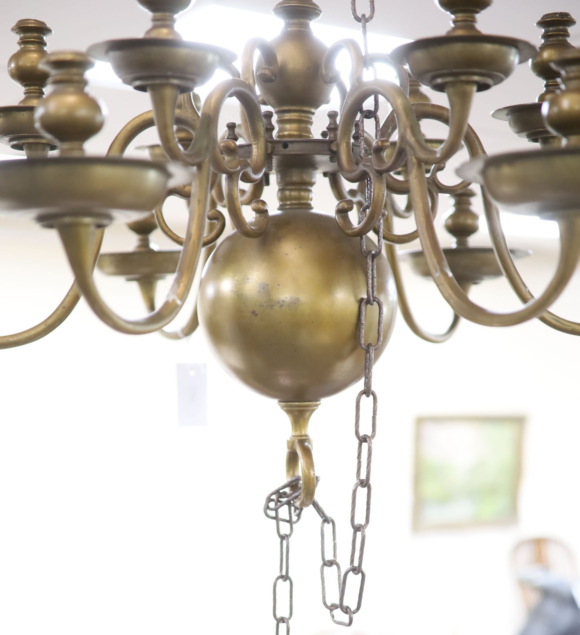 A 17th century style Dutch design brass six branch two tier ceiling chandelier